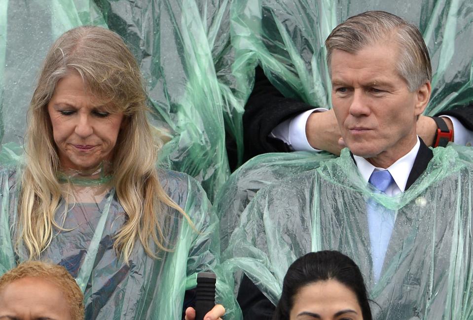 Then outgoing Virginia Governor Bob McDonnell (R) and his wife Maureen, await the start of the swearing-in ceremony of Terry McAuliffe as Virginia's governor in Richmond, Virginia, in this January 11, 2014 file photo. Former Virginia Governor Robert McDonnell and his wife pleaded not guilty to federal bribery charges on Friday and were released on their own recognizance until trial. REUTERS/Mike Theiler/Files (UNITED STATES - Tags: POLITICS)