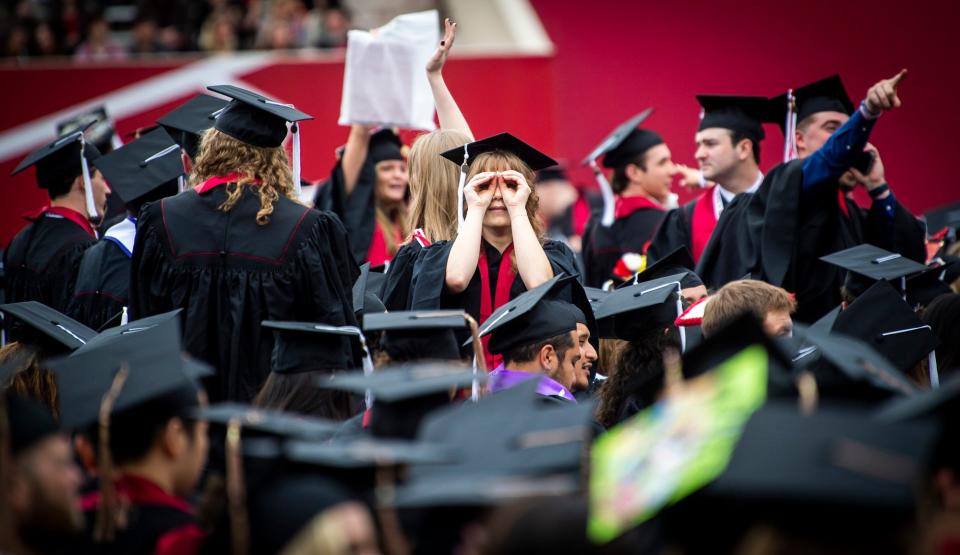 Lauren Bigelow looks for friends and family at the 194th undergraduate commencement at Indiana University Bloomington on Saturday, May 6, 2023. This photo won the Features division in the Society of Professional Journalists photo category for newspapers with under 10,000 circulation.