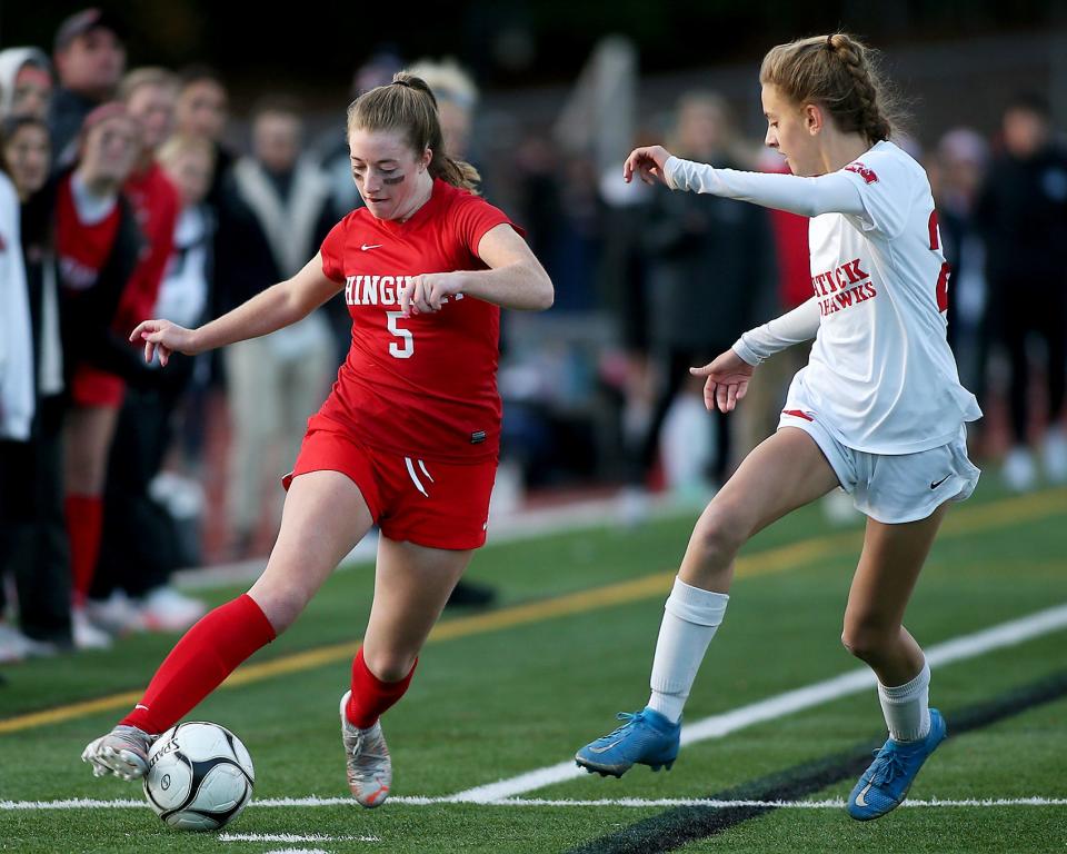 Hingham's Ava Maguire looks to get past Natick’s Kendall Hacker during second half action of the Division 1 state final at Whitman-Hanson High School on Saturday, Nov. 20, 2021.