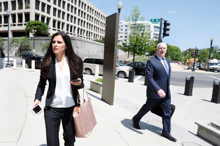 Lawyers Eric Dubelier and Katherine Seikaly leave U.S. District Court, following the arraignment of Concord Management and Consulting LLC, one of three entities and 13 Russian individuals indicted in an alleged criminal and espionage conspiracy to tamper in the 2016 U.S. presidential election, in Washington, U.S., May 9, 2018. REUTERS/Yuri Gripas