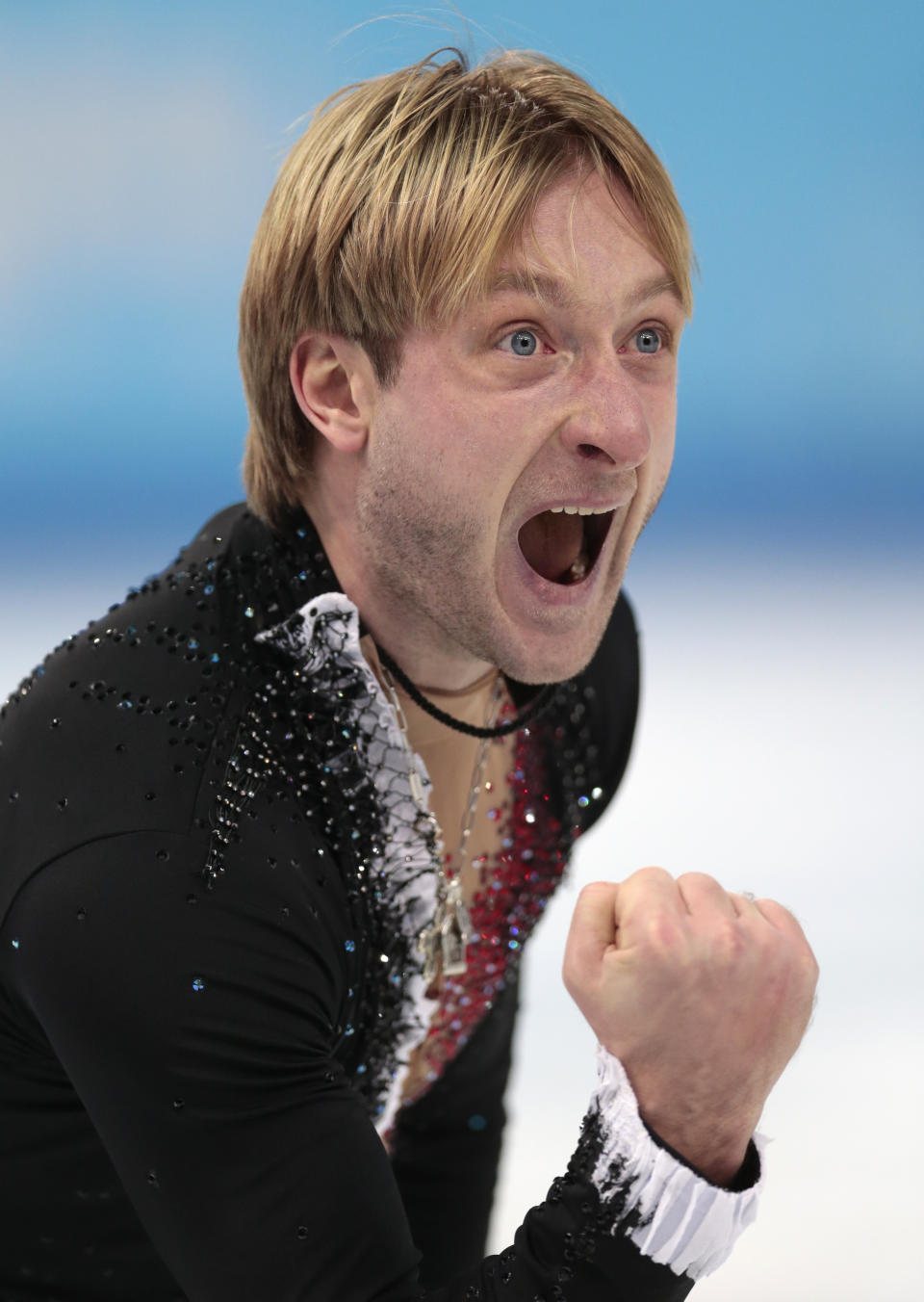 Evgeni Plushenko of Russia celebrates after competing in the men's team short program figure skating competition at the Iceberg Skating Palace during the 2014 Winter Olympics, Thursday, Feb. 6, 2014, in Sochi, Russia. (AP Photo/Ivan Sekretarev)