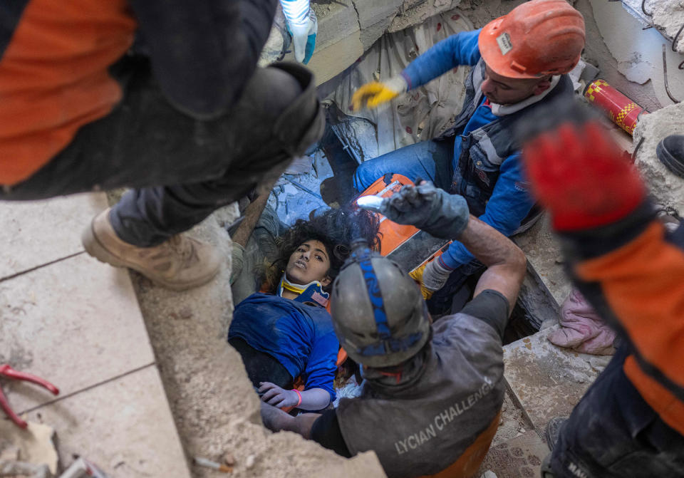Emergency personnel conduct a rescue operation to save 16-year-old Melda from the rubble of a collapsed building in Hatay, southern Turkey, on Feb. 9, 2023, where she has been trapped since a 7.8-magnitude earthquake struck the country's south-east.<span class="copyright">Bulent Kilic—AFP/Getty Images</span>