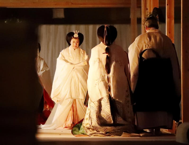 Japan's Empress Masako walks to Yukiden to attend 'Daijosai' at the Imperial Palace in Tokyo