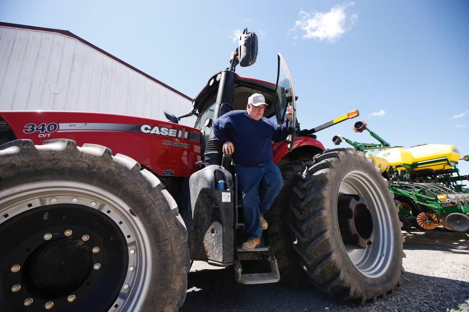 Bret Davis, a soybean farmer, steps out of his tractor in Delaware, Ohio, on Tuesday, May 14, 2019. Some farmers fear the protracted trade war with China will permanently alter their sales, leaving them without a foothold in one of their largest markets. (AP Photo/Angie Wang)