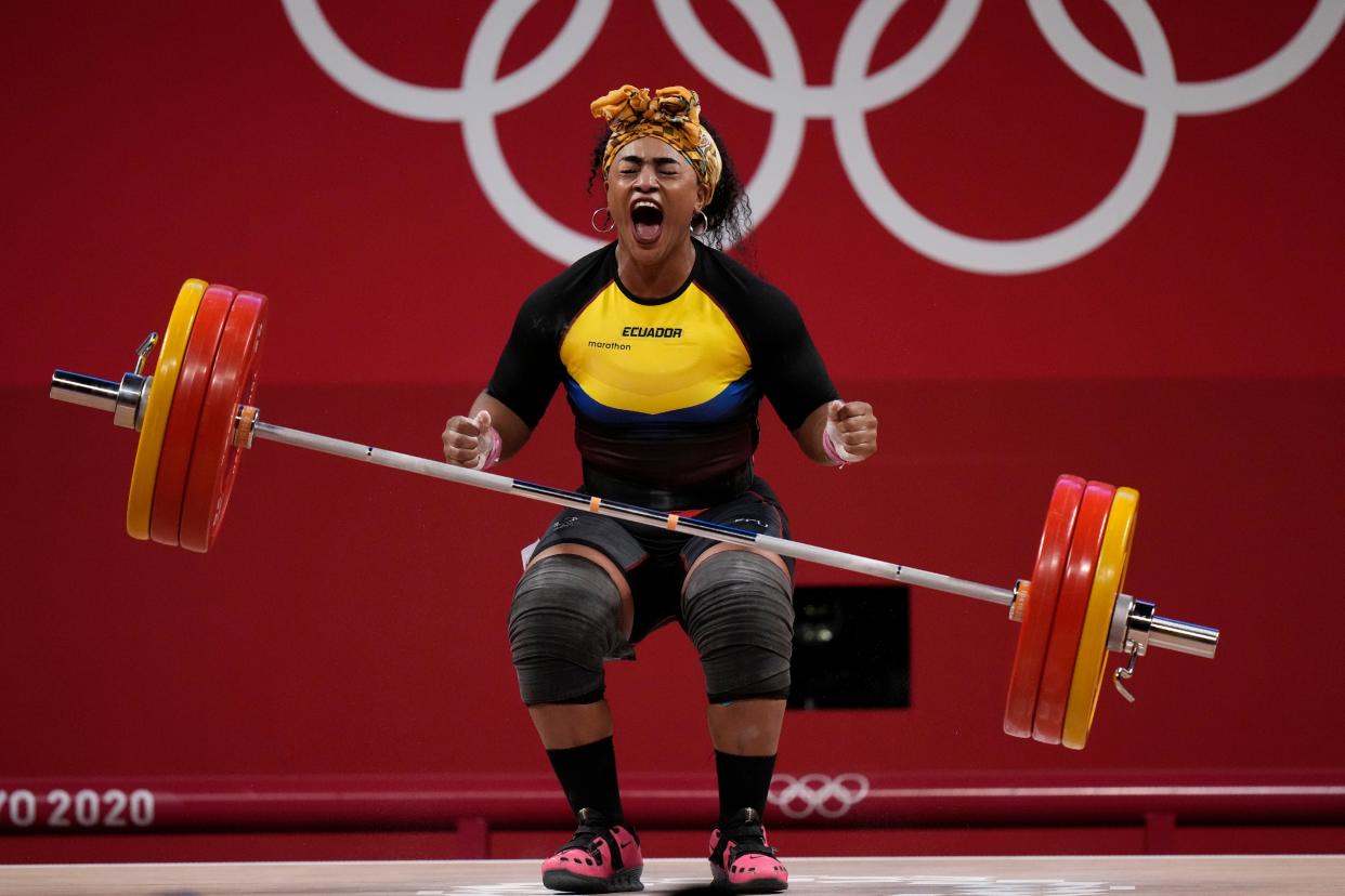 Tamara Yajaira Salazar Arce of Ecuador reacts after a successful lift, in the women's 87kg weightlifting event at the 2020 Summer Olympics, Monday, Aug. 2, 2021, in Tokyo, Japan.