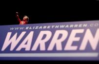 A figurine of U.S. Democratic presidential candidate Senator Elizabeth Warren sits on the podium during a campaign rally in Denver