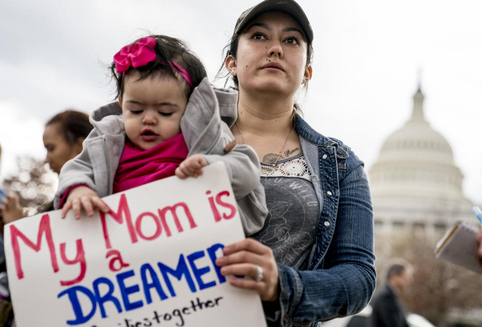 <p>Yesenia Aguilar of Reading, Penn. holds her one year old daughter Denalli Urdaneta at an immigration rally on Capitol Hill in Washington, Tuesday, Jan. 23, 2018. (Photo: Andrew Harnik/AP) </p>