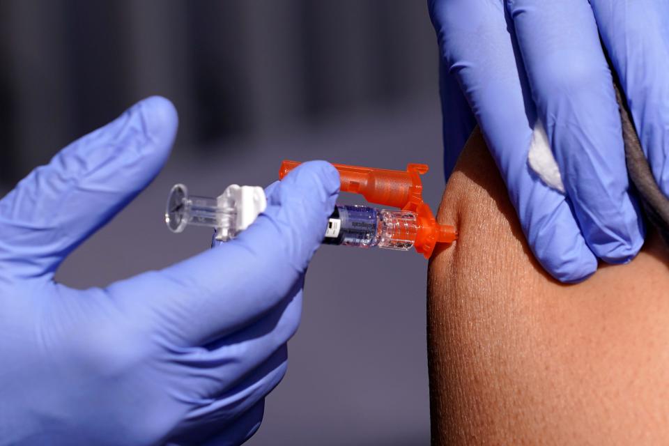 A patient is given a flu vaccine Friday, Oct. 28, 2022, in Lynwood, Calif. Seasonal flu continues to pick up steam in the U.S. (Credit: AP Photo/Mark J. Terrill, File)