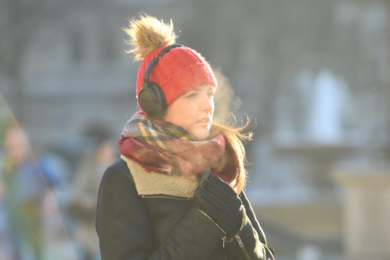 <p>Cold Commuters make their way to work across Trafalgar Square this morning</p> (Jeremy Selwyn)