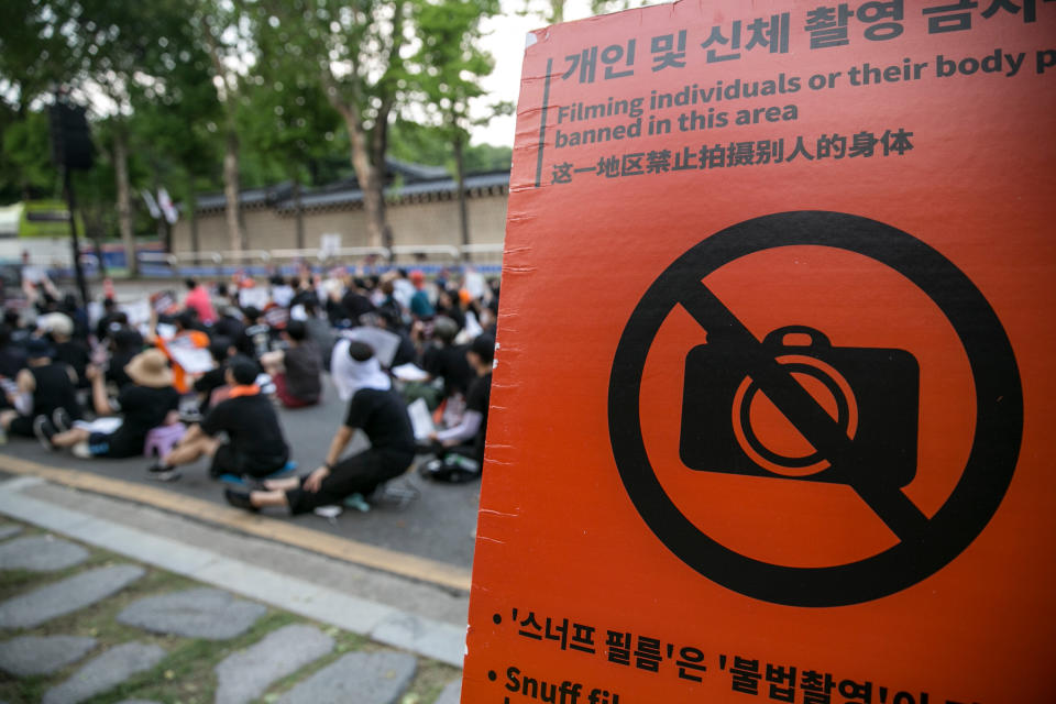 SEOUL, SOUTH KOREA - JULY 27: (SOUTH KOREA OUT) Feminists chant slogans next to the 