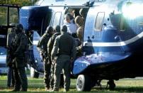 German special police escorts Stephan B. prior to a hearing at the Federal Court in Karlsruhe