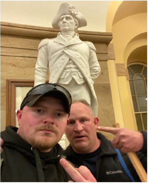 The Justice Department released a photo of Jacob Fracker and Thomas Robertson, two off-duty police officers with the city of Rocky Mount, Va., inside the U.S. Capitol during the riot Jan. 6.