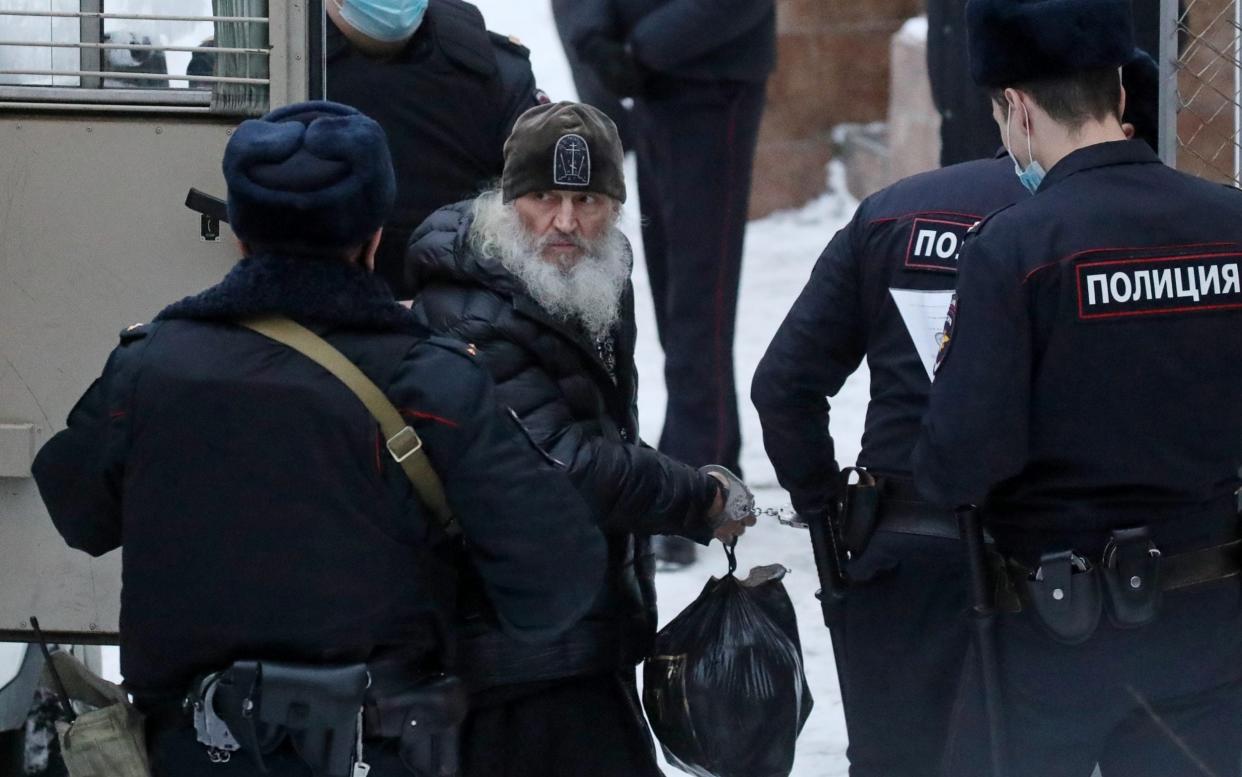 Father Romanov is taken for a hearing at Moscows Basmanny District Court - Vyacheslav Prokofyev /TASS