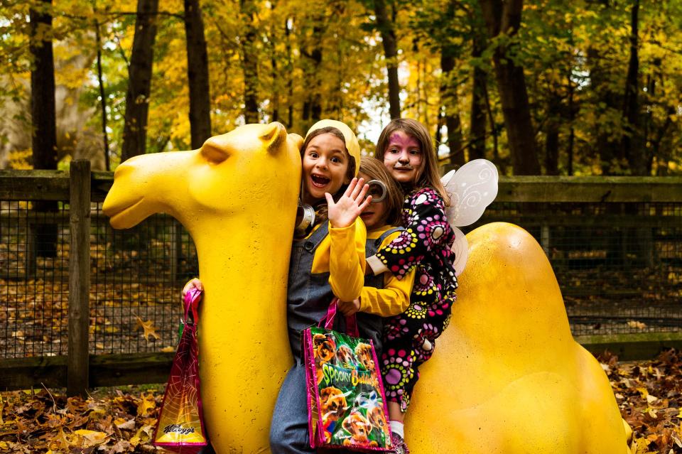 Kids sit atop the camel statue during Zoo Boo at Binder Park Zoo in 2014.