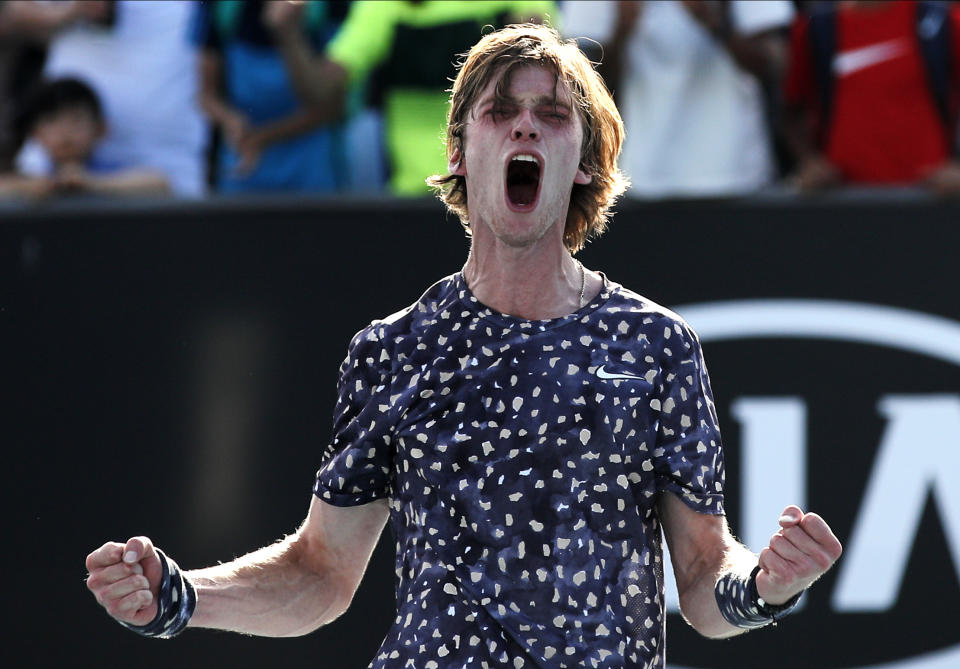 Russia's Andrey Rublev celebrates after defeating Belgium's David Goffin in their third round singles match at the Australian Open tennis championship in Melbourne, Australia, Saturday, Jan. 25, 2020. (AP Photo/Andy Wong)