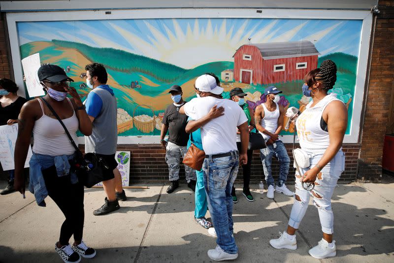 Protesters gather at the scene where Floyd was pinned down by a police officer in Minneapolis