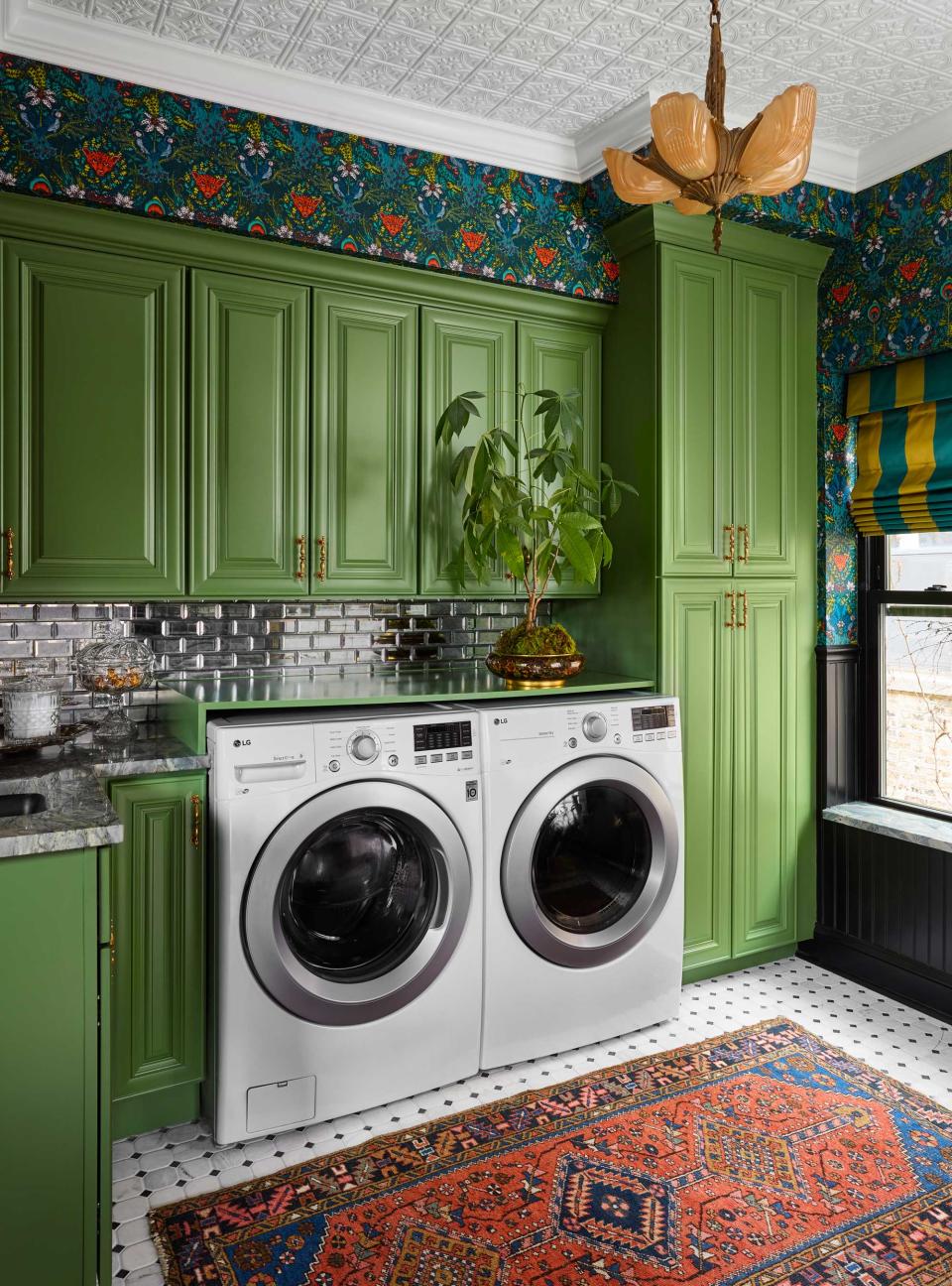 a green laundry room with decorative objects