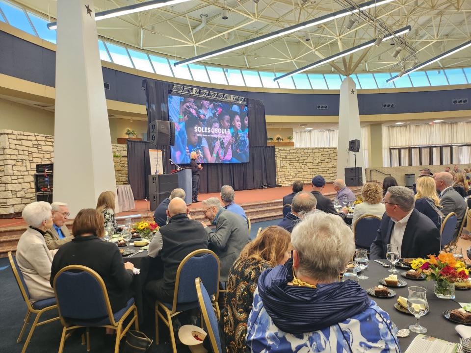 Keynote speaker Buddy Teaster, president and CEO of Soles4Souls, speaks about the importance of giving during the 31st annual Leading Through Giving celebration luncheon, held in recognition of National Philanthropy Day on Friday at the Amarillo Civic Center Grand Plaza.