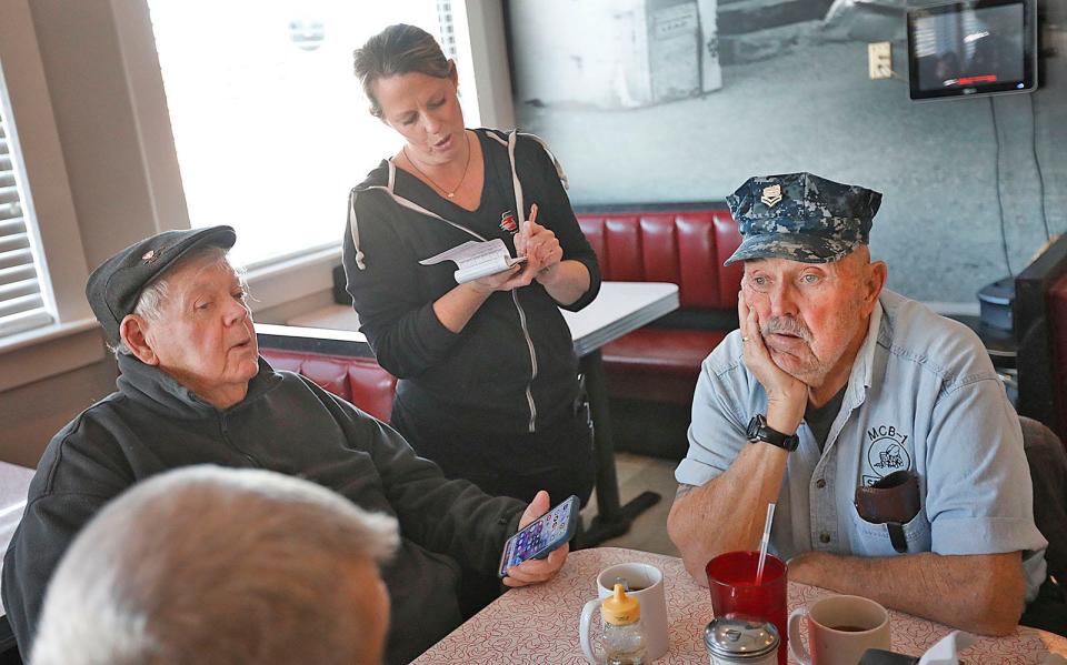 Mike Burke, left, of Duxbury, and Barney Dowd, right, of Marshfield, attend the weekly gathering of veterans at the Brant Rock Hop in Marshfield on Tuesday, Jan. 10, 2023.