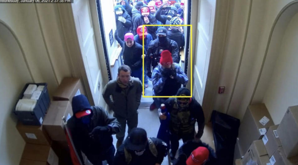 Image 6: Still from CCTV (Exhibit 501.2) showing Munchel and Eisenhart (yellow square) entering the Capitol at 2:37:38 p.m.