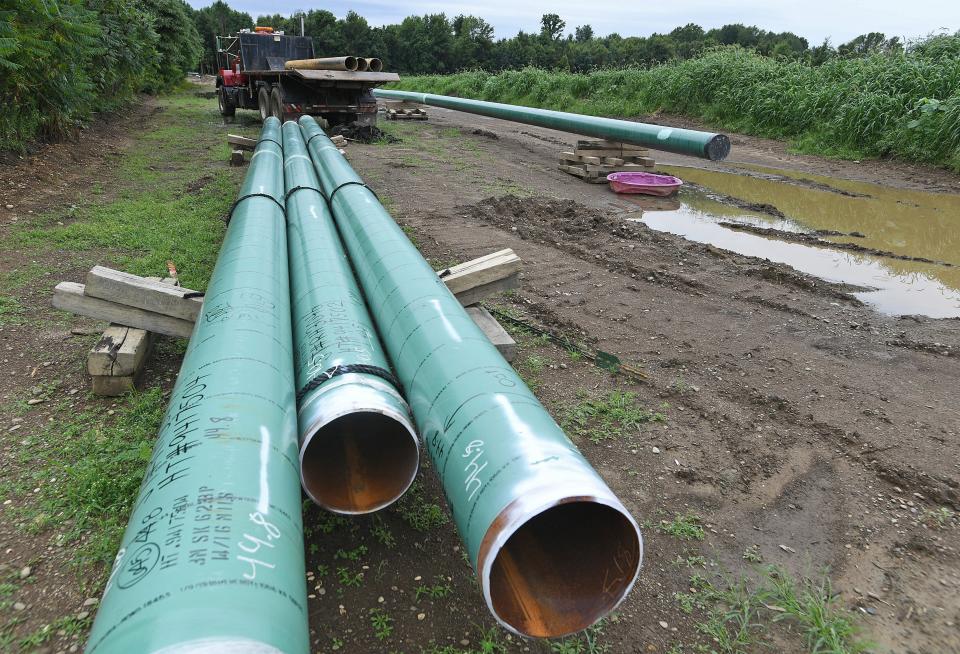 Shown in this Aug. 22, 2019 photo, 12-inch wide natural gas transmission pipes lay beside U.S. Route 20 (not shown) in North Kingsville, Ohio.