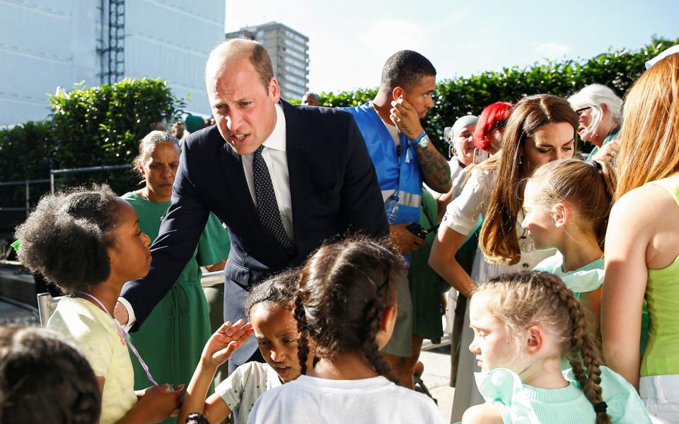 The Duke and Duchess of Cambridge speak words of encouragement to the children - Peter Nicholls/PA