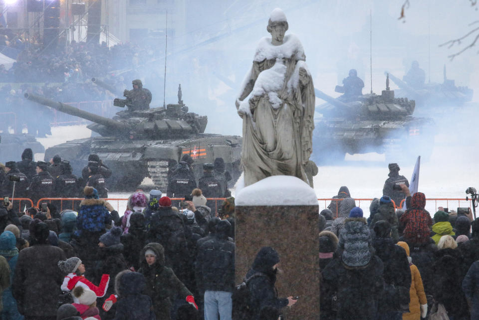 People watch the military parade at Dvortsovaya (Palace) Square during the celebration of the 75th anniversary of the end of the Siege of Leningrad during World War II in St. Petersburg, Russia, Sunday, Jan. 27, 2019. The Nazi German and Finnish siege and blockade of Leningrad, now known as St. Petersburg, was broken on Jan. 18, 1943 but finally lifted Jan. 27, 1944. More than 1 million people died mainly from starvation during the 900-day siege. (AP Photo/Dmitri Lovetsky)