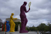 Copies of one of the most famous Greek statues, the Venus of Milo, are installed on the steps of the French National Assembly in Paris, France, Monday, April 15, 2024, to celebrate the Olympic spirit. The Venus, by artist Laurent Perbos, has regained her arms and is now equipped with the attributes of six sporting disciplines. (AP Photo/Christophe Ena)