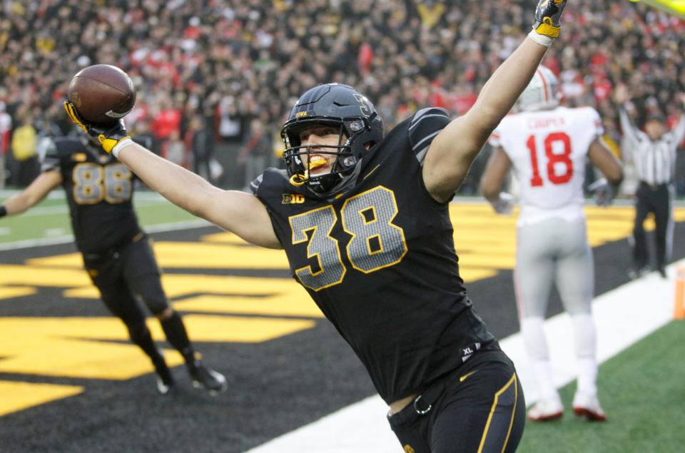IOWA CITY, IOWA- NOVEMBER 04:  Tight end T.J. Hockenson #38 of the Iowa Hawkeyes celebrates a touchdown during the third quarter against the Ohio State Buckeyes on November 04, 2017 at Kinnick Stadium in Iowa City, Iowa.  (Photo by Matthew Holst/Getty Images)