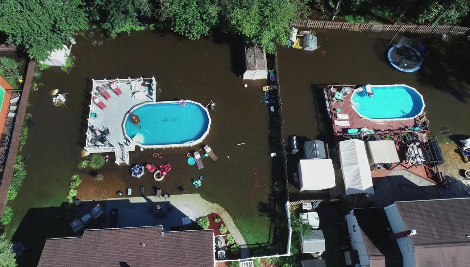 CLEAN BLUE WATERS - In the wake of Tropical Depression Ida, pools filled with clean water are a contrast to the flood waters that surround them in Lincoln Park Thursday, September 2, 2021.