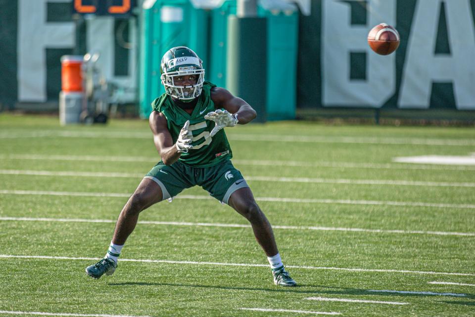 Michigan State wide receiver Jayden Reed eyes a pass during an August practice in East Lansing.