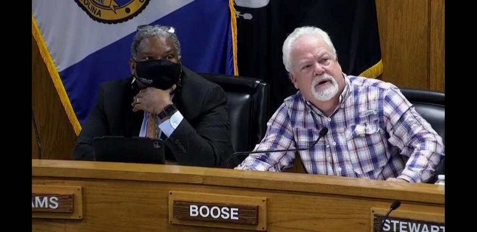 Cumberland County Commissioner Mike Boose, right, asks about COVID-19 statistics in North Carolina in a discussion with county Health Director Jennifer Green at the commissioners meeting on Nov. 1, 2021. Next to Boose is Commissioner Glenn Adams. The county has a mask requirement for public indoor settings.