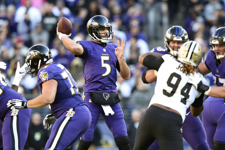 Baltimore Ravens quarterback Joe Flacco (5) throws to a receiver in the first half of an NFL football game against the New Orleans Saints, Sunday, Oct. 21, 2018, in Baltimore. (AP Photo/Gail Burton)