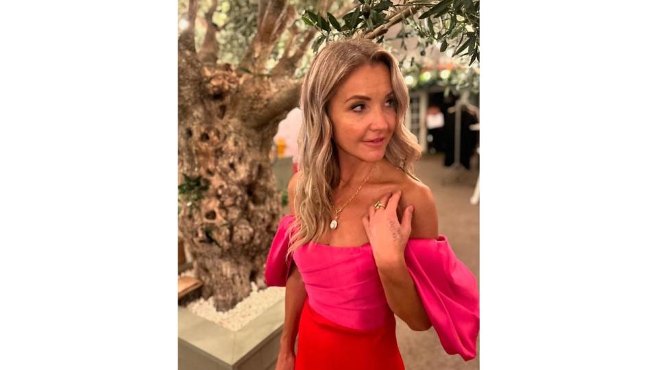 Helen Skelton in a pink and red dress