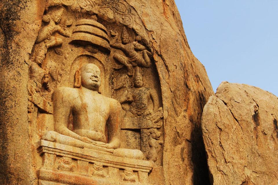 A Jain sculpture showing Mahavira in Madurai, Tamilnadu, India. <a href="https://commons.wikimedia.org/wiki/File:Mahavira_Keezhakuyilkudi.jpg" rel="nofollow noopener" target="_blank" data-ylk="slk:Francis Harry Roy S via Wikimedia Commons;elm:context_link;itc:0;sec:content-canvas" class="link ">Francis Harry Roy S via Wikimedia Commons</a>, <a href="http://creativecommons.org/licenses/by-sa/4.0/" rel="nofollow noopener" target="_blank" data-ylk="slk:CC BY-SA;elm:context_link;itc:0;sec:content-canvas" class="link ">CC BY-SA</a>