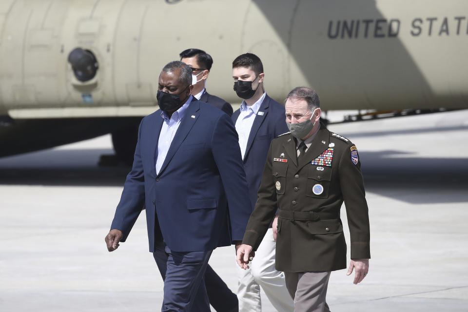 U.S. Secretary of Defense Lloyd Austin, center left, walks with United States Forces Korea, Gen. Robert B. Abrams, after Austin arrived at Osan Air Base in Pyeongtaek, South Korea Wednesday, March 17, 2021. Austin, with U.S. Secretary of State Antony Blinken, on Wednesday, is visiting South Korea, with the focus of those talks being North Korea and its nuclear ambitions.(Chung Sung-Jun/Pool Photo via AP)
