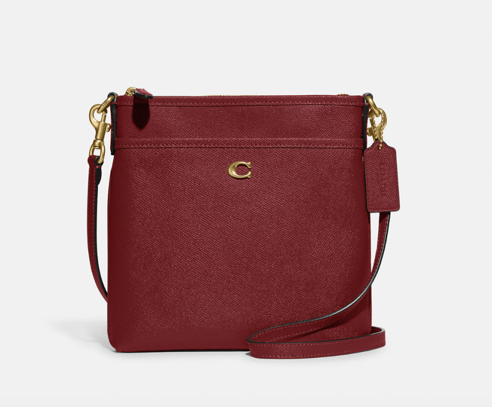 Kitt Messenger Crossbody in cherry (Photo via Coach)