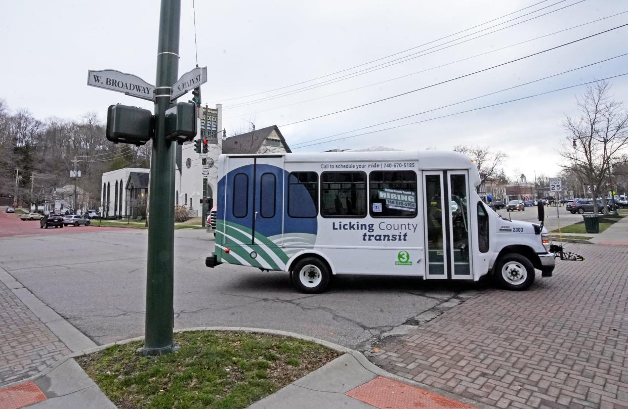 The new Licking County Transit bus travels down Broadway on Monday in Granville. The bus connects Granville to the Newark area.