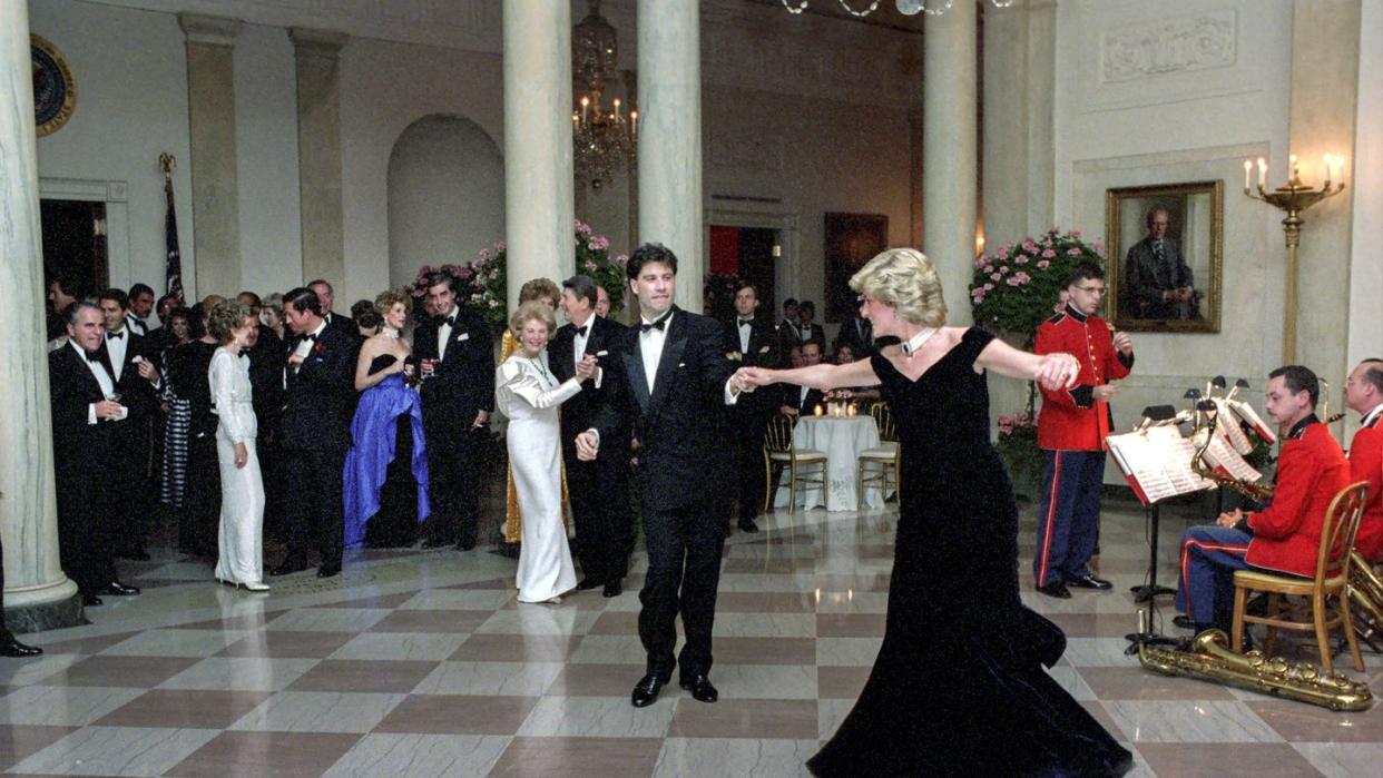 princess diana dancing with john travolta in cross hall at the white house