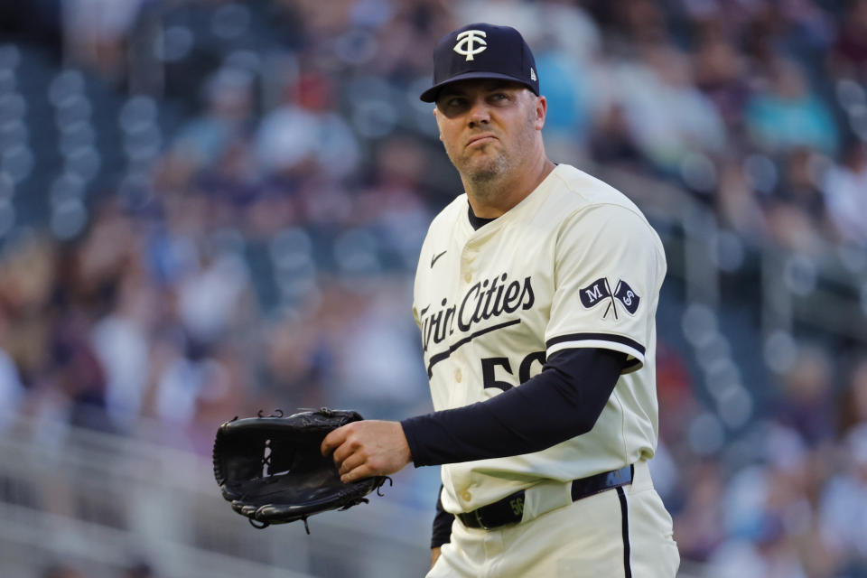 Minnesota Twins relief pitcher Caleb Thielbar leaves the field during the sixth inning of the team's baseball game against the Colorado Rockies on Tuesday, June 11, 2024, in Minneapolis. (AP Photo/Bruce Kluckhohn)