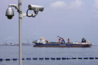 Netherlands-flagged dredger Vox Maxima is seen anchored off the coast in Sentosa Island in Singapore, Sunday, June 16, 2024. An oil spill caused by the dredger boat hitting a stationary cargo tanker has blackened part of Singapore’s southern coastline, including the popular resort island of Sentosa, and sparked concerns it may threaten marine wildlife. (AP Photo/Suhaimi Abdullah)