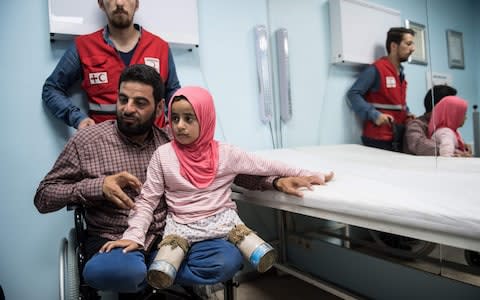 Maya and her father at the Istanbul clinic on June 29 - Credit: ENT KILICBULENT KILIC/AFP