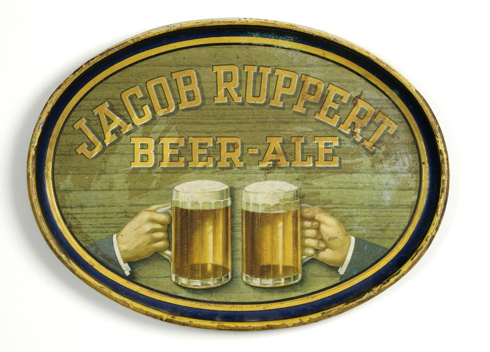 This undated photo provided by the New-York Historical Society shows a metal “Jacob Ruppert Beer-Ale,” bar tray dated 1900-1930, which will be a part of the uncoming exhibit "Beer Here," which will feature a small beer hall and the chance to try a selection of New York City and state artisanal beers. (AP Photo/ New-York Historical Society)
