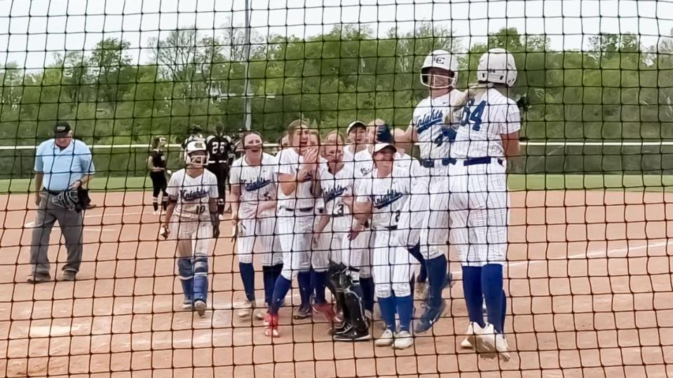 Lexington Catholic’s Abby Hammond (4) celebrates crossing the plate with teammate Ava Emmert (64) and the rest of the Knights after hitting a solo home run in the top of the sixth inning against South Warren in the Lafayette Five Star General Tournament at Great Crossing Park in Georgetown on Saturday. Jared Peck/jpeck@herald-leader.com