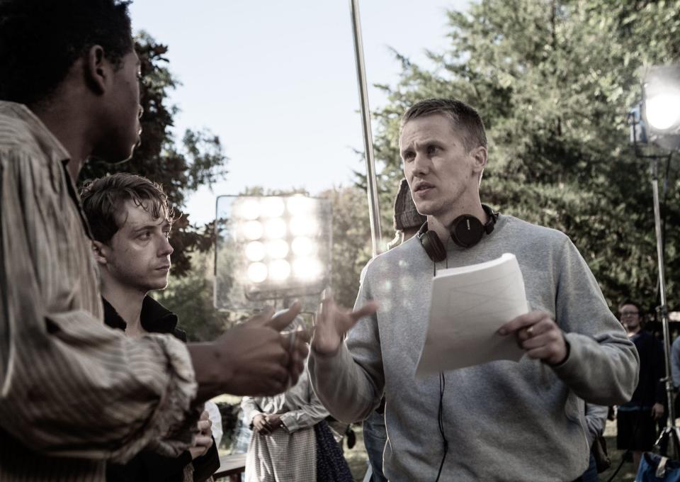 Actors RJ Cyler and Gerran Howell meet with director Brett Smith during the filming of "Freedom's Path."