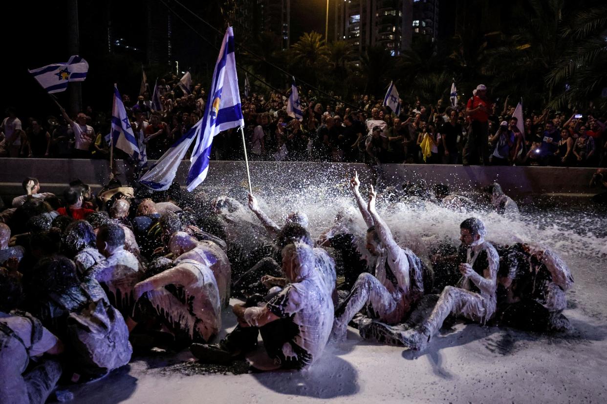 Israeli police use a water cannon to disperse protesters during a rally to show support for hostages who were kidnapped during the deadly Oct. 7 attack.