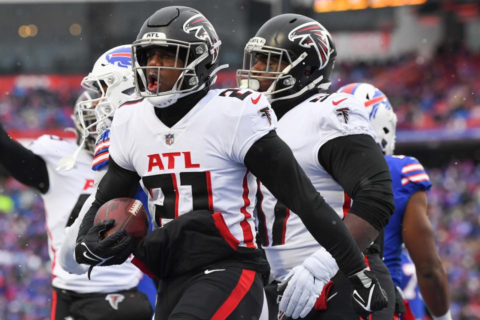 Jan 2, 2022; Orchard Park, New York, USA; Atlanta Falcons safety Duron Harmon (21) reacts to his interception against the Buffalo Bills during the first half at Highmark Stadium. Mandatory Credit: Rich Barnes-USA TODAY Sports