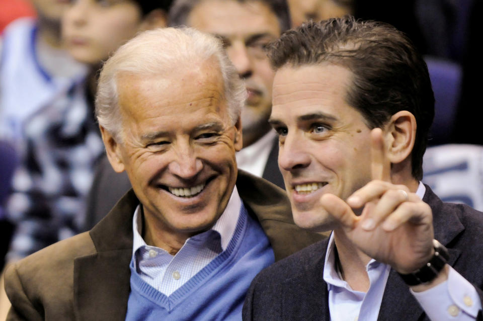 Then U.S. Vice President Joe Biden and his son Hunter Biden attend an NCAA basketball game between Georgetown University and Duke University in Washington, U.S., January 30, 2010. (Photo:Jonathan Ernst/Reuters)