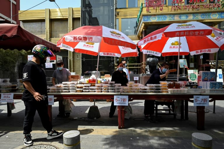 Many restaurants are offering only takeaway food after dining in was banned (AFP/Jade GAO)