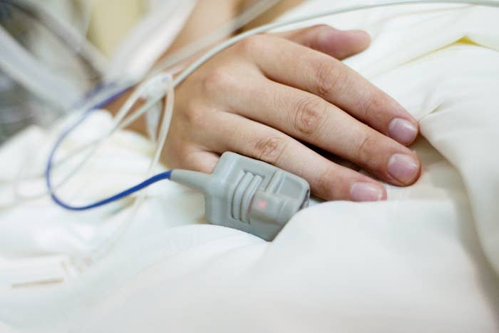 close up of a hand with hospital IVs on their hand